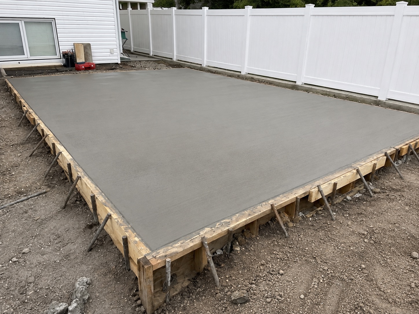 A newly installed backyard concrete patio